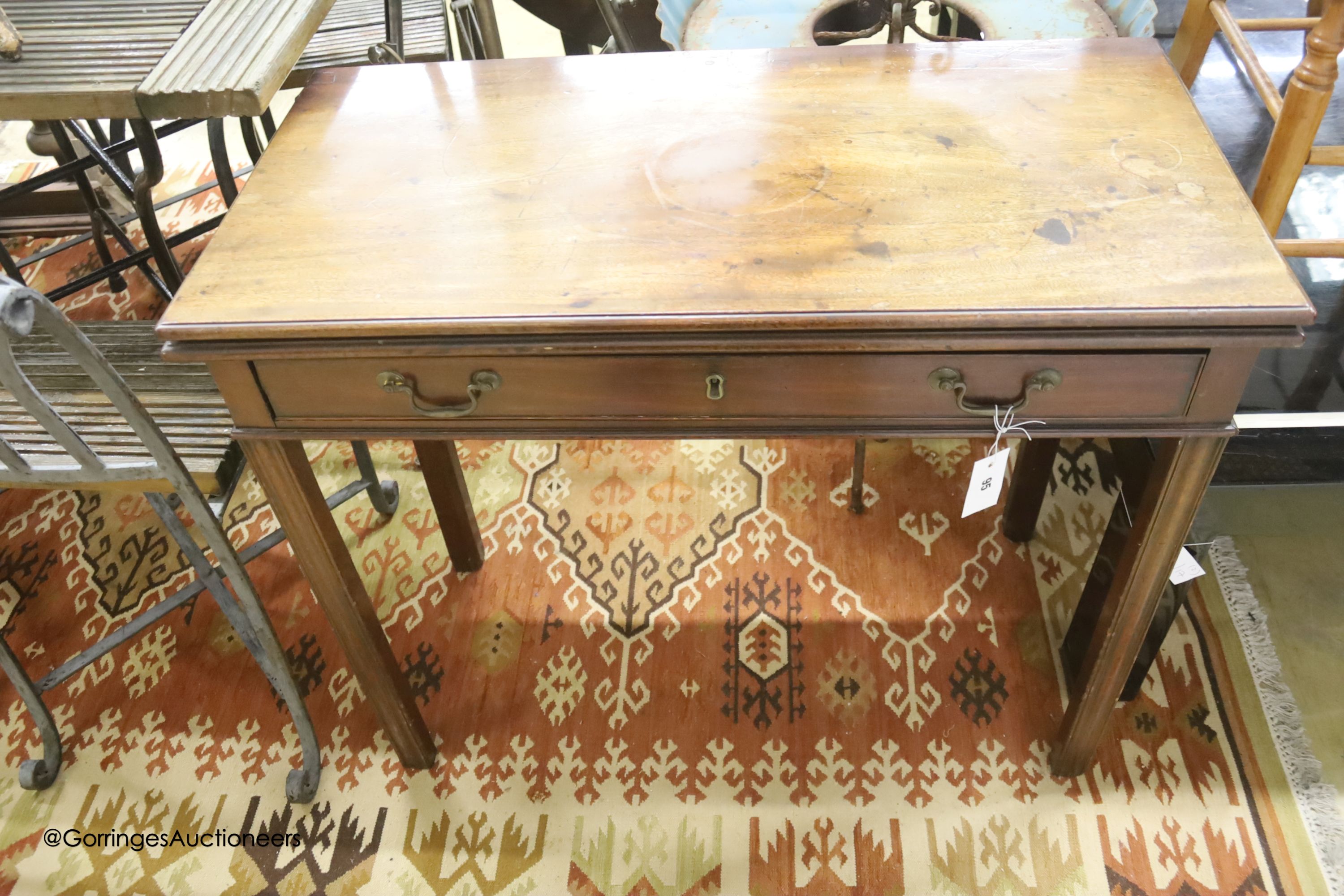 A George III rectangular mahogany folding tea table, width 87cm, depth 43cm, height 72cm